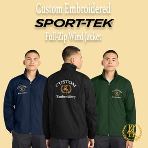 May include: Three men wearing custom embroidered Sport-Tek full-zip wind jackets. The jackets are navy blue, black, and dark green. Each jacket has a custom embroidery design on the front and back. The text "Custom Embroidery" is visible.