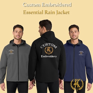 May include: Three hooded rain jackets in grey, black, and navy blue. Each jacket has a zip closure and the text "Custom Embroidered" and "Embroidery". The jackets are displayed on a light yellow background.