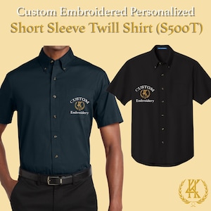May include: Two short-sleeved twill shirts, navy and black, with custom embroidery. The navy shirt is buttoned and worn by a person. The black shirt is displayed on a plain background. The text at the top says "Custom Embroidered Personalized Short Sleeve Twill Shirt".