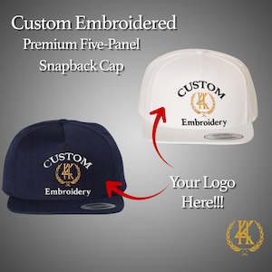 May include: Two custom embroidered snapback caps, one navy blue and one white. Both caps feature the text "CUSTOM Embroidery" in a stylized font with a gold emblem. The image also includes the text "Your Logo Here!!!".