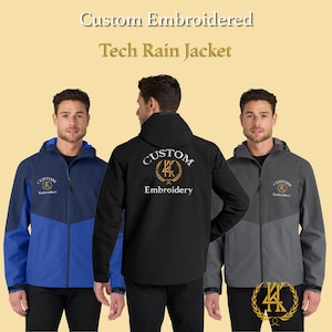 May include: Custom embroidered tech rain jackets in blue, black, and gray. Each jacket features a hood and a front zipper. The jackets have the words "Custom Embroidery" embroidered on them. The jackets are displayed on a light yellow background.