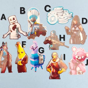 May include: A set of ten Fortnite character stickers. The stickers feature characters like Marshmello, a llama, a pink bear, a banana, and a soldier. The stickers are printed on a clear background.