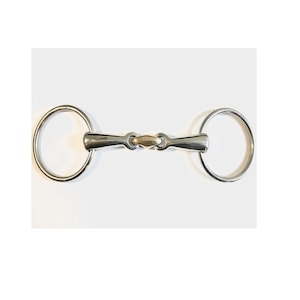 May include: A stainless steel horse bit with two large circular rings connected by a central mouthpiece. The mouthpiece is a lighter gold color, and the bit is designed for use in equestrian activities.