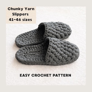 May include: A pair of grey chunky yarn slippers. The slippers have a thick, woven texture. Text on the image reads "Chunky Yarn Slippers 41-46 sizes" and "Easy Crochet Pattern".