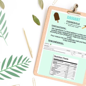 May include: A recipe card for a keto-friendly fudgesicle dessert. The card includes instructions, ingredients, and nutritional information. The image shows a chocolate-covered popsicle on a light blue background.