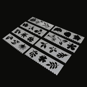 Könnte beinhalten: Satz mit 10 Kunststoff-Schablonen mit verschiedenen Blatt- und Pflanzenmotiven. Die Schablonen sind weiß und haben einen gewellten Rand.