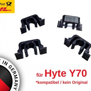 Könnte beinhalten: Vier schwarze Kunststoffclips für ein Hyte Y70 Computergehäuse. Der Text "*kompatibel / kein Original" ist unter dem Produktnamen gedruckt.