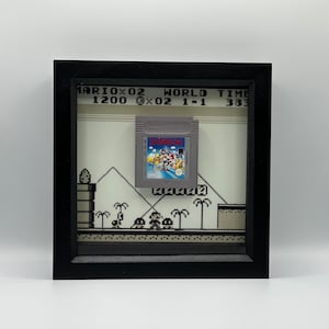 Framed Nintendo Super Mario Land (Gameboy) with custom background (glows in the dark), mounted retro game art