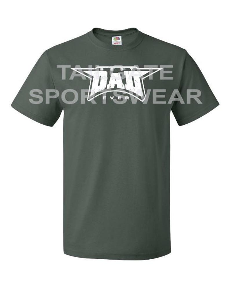 May include: A dark green t-shirt with a white star and the text "BEST DAD EVER" in a distressed font.