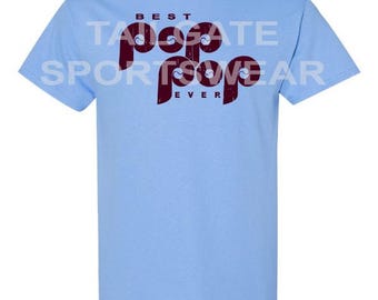 May include: Light blue t-shirt with a maroon graphic that says "Best Pop Pop Ever".