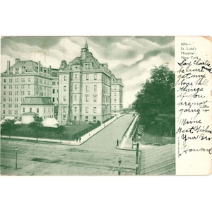 May include: Vintage postcard featuring St. Luke's Hospital in New York. The image, in shades of green, shows a large building with multiple stories, a long road, and a handwritten message on the right side. The postcard is a historical item.