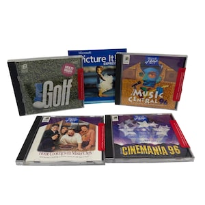May include: A collection of Microsoft Home software CD-ROMs, including "Golf," "Picture It! Express," "Music Central 96," "Home Cooking with Master Chefs," and "Cinemania 96." The CD cases are in clear plastic with colorful cover art.