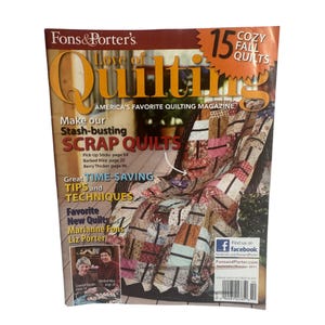 以下が含まれることがあります： 「Fons & Porter's Love of Quilting」の雑誌の表紙。カラフルなキルトが特徴です。「Scrap Quilts」、「Cozy Fall Quilts」、「America's Favorite Quilting Magazine」などのテキストが含まれています。雑誌は2011年9月/10月発行です。