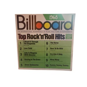 Puede incluir: Una portada de la revista Billboard de 1968 con el titular "Top Rock'n'Roll Hits". La portada tiene un fondo blanco con la palabra "Billboard" en letras grandes y en negrita. Las 10 mejores canciones están listadas en un recuadro verde.