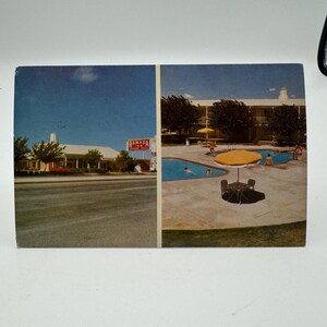 May include: A vintage postcard showing a split image of a Ramada Inn motel. The left side shows the exterior of the motel with a sign that reads "Ramada Inn". The right side shows a swimming pool with people swimming and relaxing around a yellow umbrella.