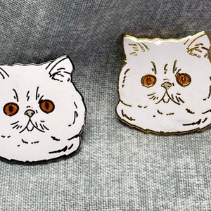 White Persian cat hat pin.