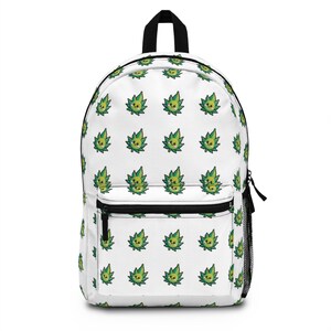 May include: White backpack featuring a repeating pattern of green cannabis leaf cartoon characters with smiling faces. The backpack has a black top handle, black zippers, and a black mesh side pocket. The bag is designed for carrying books and supplies.