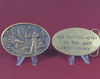 Two belt buckles - bowhunter and "Old hunters never die, they just stay loaded"