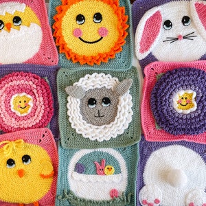 May include: Nine colorful crochet squares with different designs, including a sun, a bunny, a lamb, a flower, and a chick. The squares are all made with different colored yarn and have a variety of textures.