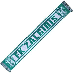 May include: A green and white scarf with the text "FK ŽALGIRIS" in large, bold letters. The scarf has a fringe on both ends and features the team's logo, a shield with a soccer ball and the words "ŽALGIRIS VILNIUS".