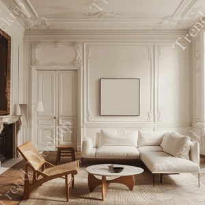 May include: A stylish interior with a white corner sofa, a round coffee table, and a wooden chair. The room features ornate white wall panelling, a fireplace, and a framed artwork. A neutral rug covers the floor.