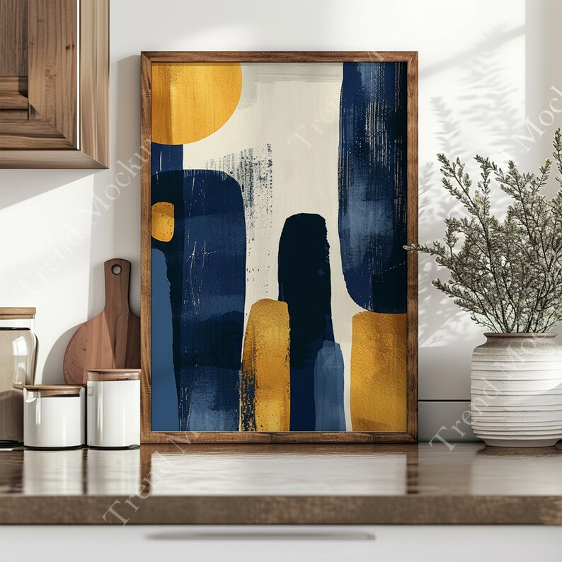 May include: Abstract art print with a wooden frame. The print features a white background with blue and yellow abstract shapes.