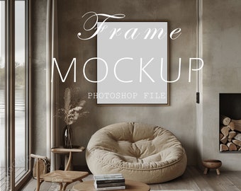 May include: Interior scene with a framed mockup on a wall, featuring the text "Frame Mockup Photoshop File." The room includes a large beige beanbag chair, wooden furniture, and a small rug. A window and fireplace are also visible.
