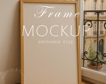May include: A rectangular wooden frame mockup with the words "Frame MOCKUP PHOTOSHOP FILE" in white script. The frame is leaning against a wall, with a window and a building in the background.