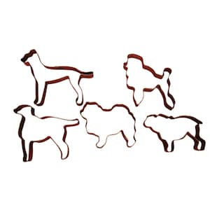 May include: Five brown metal dog-shaped cookie cutters. The cutters depict different dog breeds, including a poodle, a bulldog, and a doberman. These cutters are ideal for baking dog-themed treats.