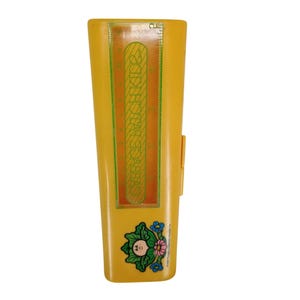 May include: A yellow plastic ruler with a clear plastic overlay featuring the text "Cabbage Patch Kids" and a measurement scale. The ruler has a small image of a Cabbage Patch Kid with flowers.