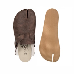 May include: A set of three ceramic mugs with a speckled, matte finish. The mugs are in shades of cream, light gray, and dark gray. Each mug has a simple, minimalist design, perfect for coffee or tea.