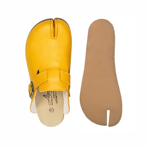 May include: A set of three ceramic mugs with a speckled, matte finish. The mugs are in shades of cream, light gray, and dark gray. Each mug has a simple, minimalist design, perfect for coffee or tea.