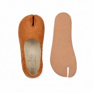 May include: A set of three ceramic mugs with a speckled, matte finish. The mugs are in shades of cream, light gray, and dark gray. Each mug has a simple, modern design and a rounded handle.