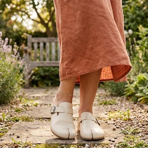 May include: A set of three ceramic mugs with a speckled, matte finish. The mugs are in shades of cream, light gray, and dark gray. Each mug has a simple, minimalist design, perfect for coffee or tea.