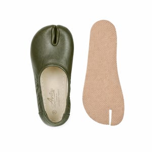 May include: A rustic wooden sign with the text "Welcome to our home" in white lettering. The sign features a distressed finish and a simple, inviting design, perfect for a front porch or entryway.