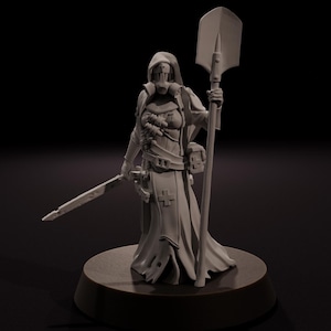 May include: A gray figurine of a robed figure with a hooded mask, holding a shovel-like staff and a sword. The figure has a medical cross on the chest and is standing on a circular base. The background is dark.