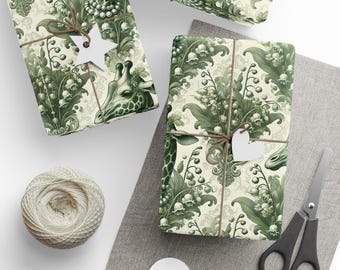 May include: Green and white wrapping paper with a pattern of giraffes and lilies of the valley. The paper is tied with twine and decorated with white paper stars and hearts.