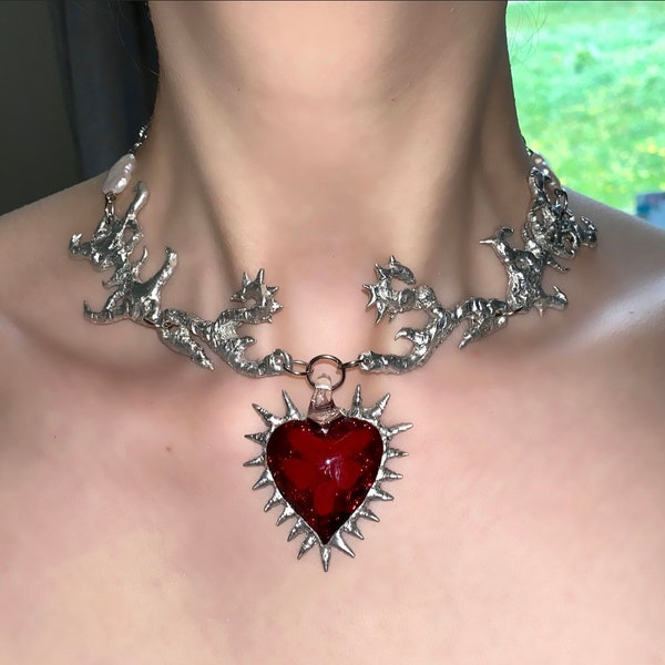 Handmade metal abstract necklace with spiky red glass heart pendant