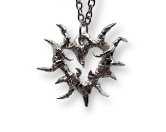 Abstract metal spiky heart pendant