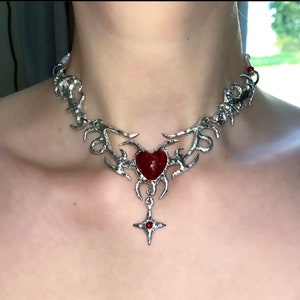 Abstract handmade metal necklace with red heart pendant