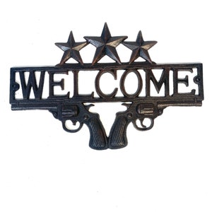 WELCOME SIGN/GUNS