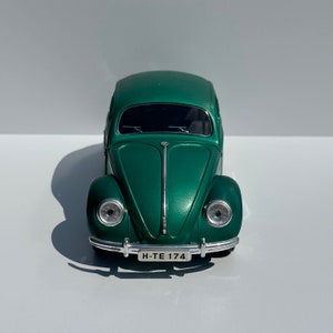 Vintage Die-Cast Model Car of a Green Volkswagen Beetle Echella Solido and Made in France.