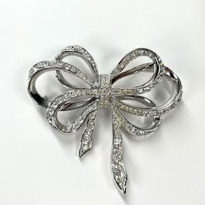 Vintage Brooch in Silver Tone with Rhinestone Bow by Kenneth Jay Lane for Avon