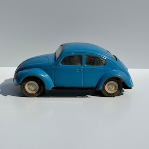 Vintage Metal Car of a Volkswagen Beetle by Tonya