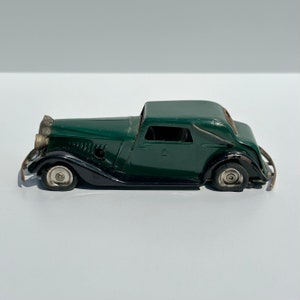 Vintage Car of Vauxhall Green Cabriolet with Key and Made by Tri-Ang Minic in England.