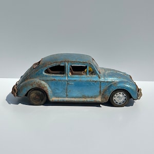 Vintage Car of a Blue Volkswagen Beetle and Made in Japan 1960s