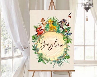 May include: A canvas print featuring a circular wooden sign with the name "Jeylan" written in cursive. The sign is surrounded by green leaves and flowers. The characters Simba, Pumbaa, Timon, and Rafiki from the Lion King movie are depicted on the sign.