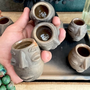 Oaxacan black clay face mezcal bar set for eight (8) from San Bartolo Oaxaca with matching serving plate