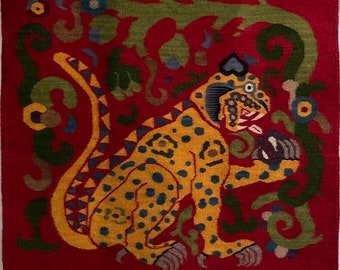 Handwoven colorful wool Zapotec rug from Teotitlan del Valle, Oaxaca, Mexico with jaguar eating heart design—unique piece