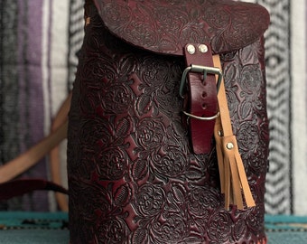 Dark deep red stain floral stamped bound leather backpack from Mexico